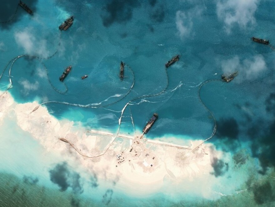 Satellite images from March 17, 2015 show new structures and construction equipment present on Mischief Reef in the South China Sea