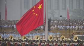 The Chinese flag is raised ahead of a military parade to commemorate the 80th anniversary of Japan's World War II surrender held in front of Tiananmen Gate in Beijing, Wednesday, Sept. 3, 2025. (Andy Wong/AP)