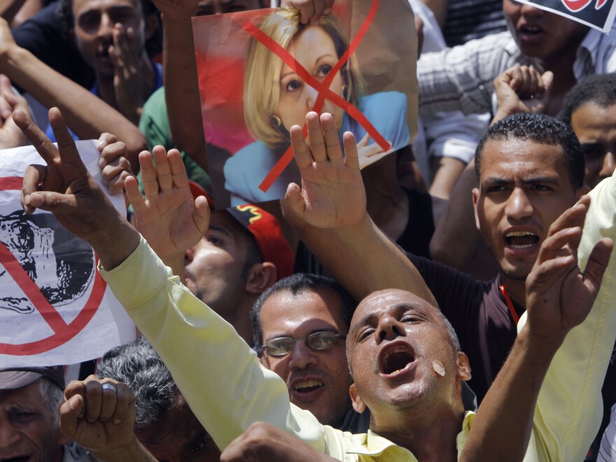 Egyptian protesters shout anti-Muslim Brotherhood slogans as they hold posters depicting U.S. Ambassador to Egypt Anne Patterson and President Mohammed Morsi in Tahrir Square, focal point of the Egyptian uprising, in Cairo, in June 2013.