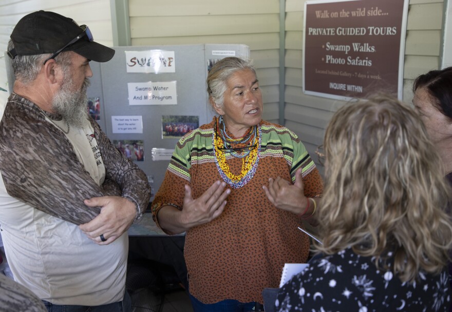 Miccosukee environmental educator and activist Betty Osceola talks to guests about the history of fighting development in the Everglades on Sunday, July 13, 2025, at Clyde Butcher’s gallery.