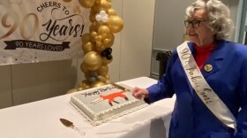 Minnie Adkins is ready to cut the cake at her 90th birthday celebration at the Morehead Conference Center.