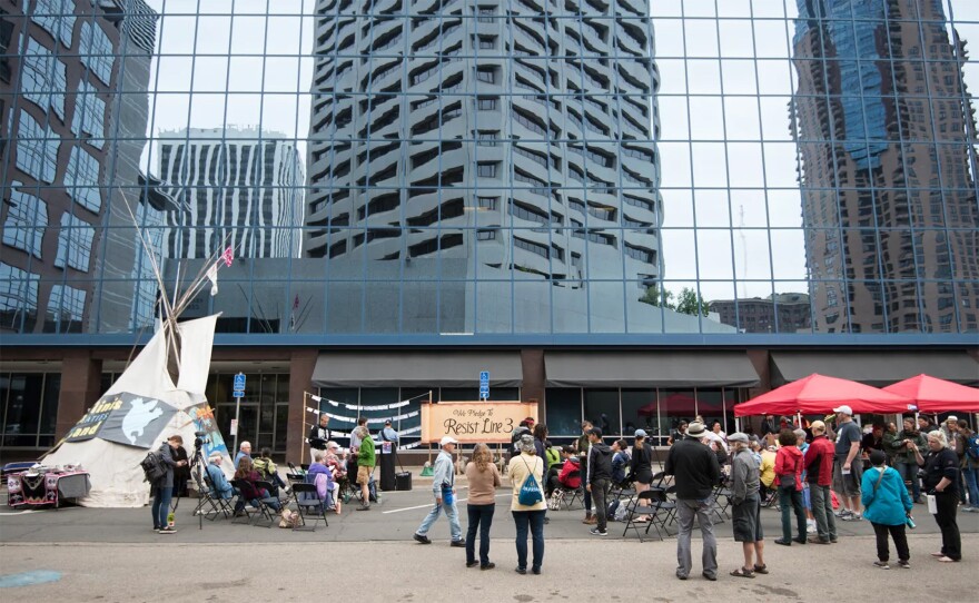 A group of protesters opposing the Line 3 oil pipeline gathered outside the Minnesota Public Utility Commission in May 2018.