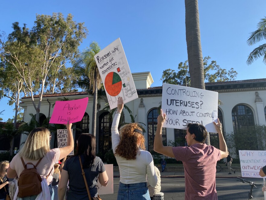 Protestors hold signs in support of abortion rights in Santa Barbara.