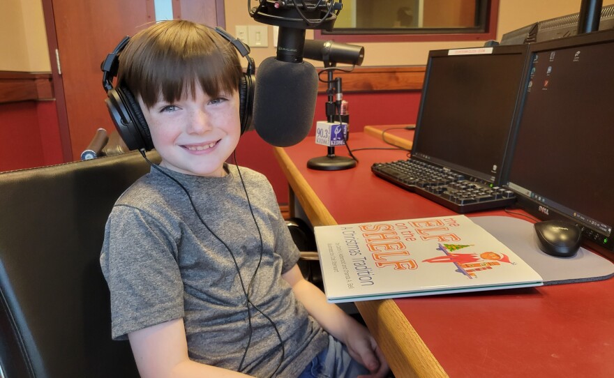 Children read holiday books at KEDM Public Radio