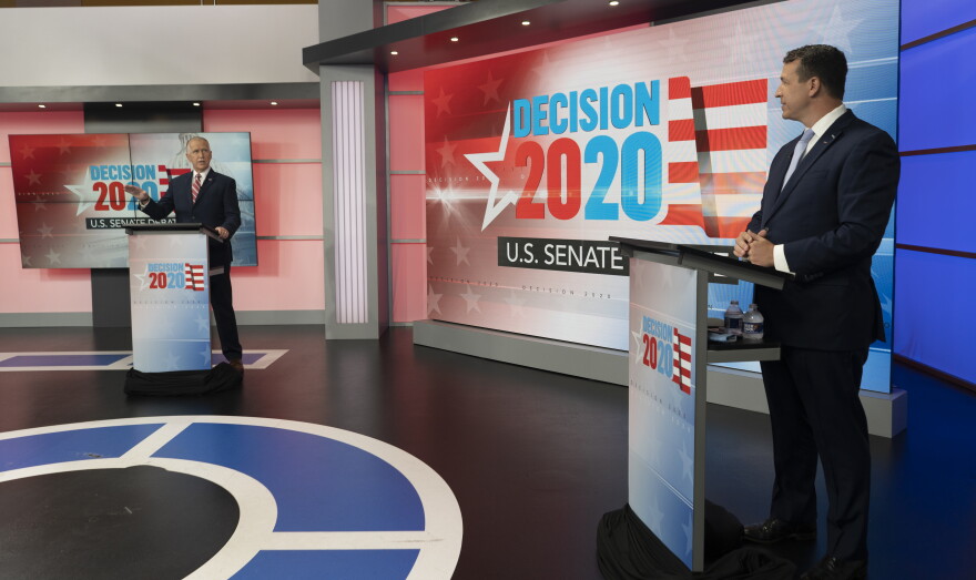 U.S. Sen. Thom Tillis, R-N.C., (left), and Democratic challenger Cal Cunningham, participate in a televised debate on Monday, Sept. 14, 2020, at the WRAL-TV studios in Raleigh, N.C.