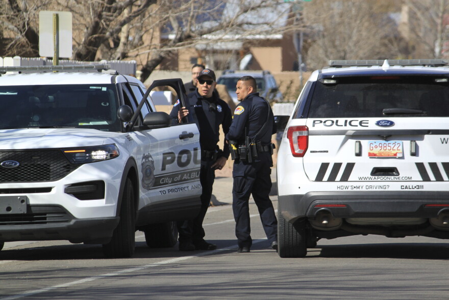 FILE – Police work outside of a home on Feb. 23, 2023, in Albuquerque, N.M., where they found two people stabbed and another person dead of a self-inflicted gunshot wound. Police on Tuesday, March 7, 2023, identified the suspect as Yoel Rodriguez, who they say fatally stabbed his ex-girlfriend and her boyfriend before shooting himself. (AP Photo/Susan Montoya Bryan, File)