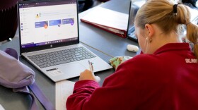 A student in James Cole's AP English course at Barnsdall High School works on a writing prompt about the recent presidential election.