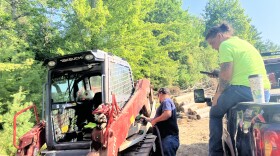 Brittany Sisco helps a coworker fuel up at the start of a three-day heat wave in August.