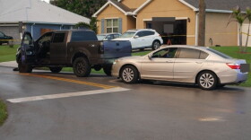 The two vehicles involved in the road rage incident, including a gray pickup and a silver sedan