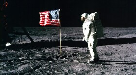 Astronaut Buzz Aldrin salutes the American flag during the Apollo 11 Moon landing.