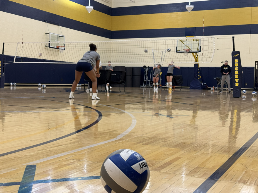 The ladies on the University of Toledo's volleyball team take turns spiking and bumping during a practice. The university is one of the first to mandate A.I. training for the entire athletic department staff.