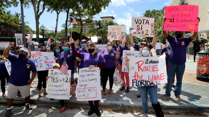 Members of 32BJ SEIU urge voters to pass Amendment 2 in Miami's Little Havana neighborhood, September 2020.