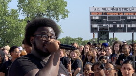 Booker T. Washington High School junior Israel Hart speaks to hundreds of students during a walkout in support of Tulsa Public Schools on Thursday, Aug. 24, 2023, at the high school's football field.