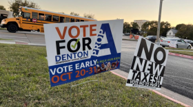 Signs for and against Denton ISD’s Proposition A stand outside the Denton Civic Center, a precinct polling location, on Election Day.