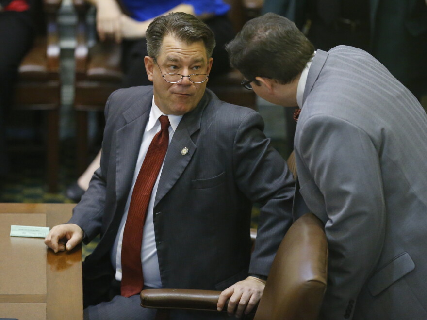 State Rep. Mike Christian, R-Oklahoma City, (left) on the floor of the Oklahoma House, March 2, 2015.