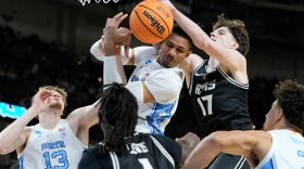 North Carolina forward Jarin Stevenson, top left, rebounds the ball during the first half in the first round of the NCAA college basketball tournament against Virginia Commonwealth, Thursday, March 19, 2026, in Greenville, S.C.