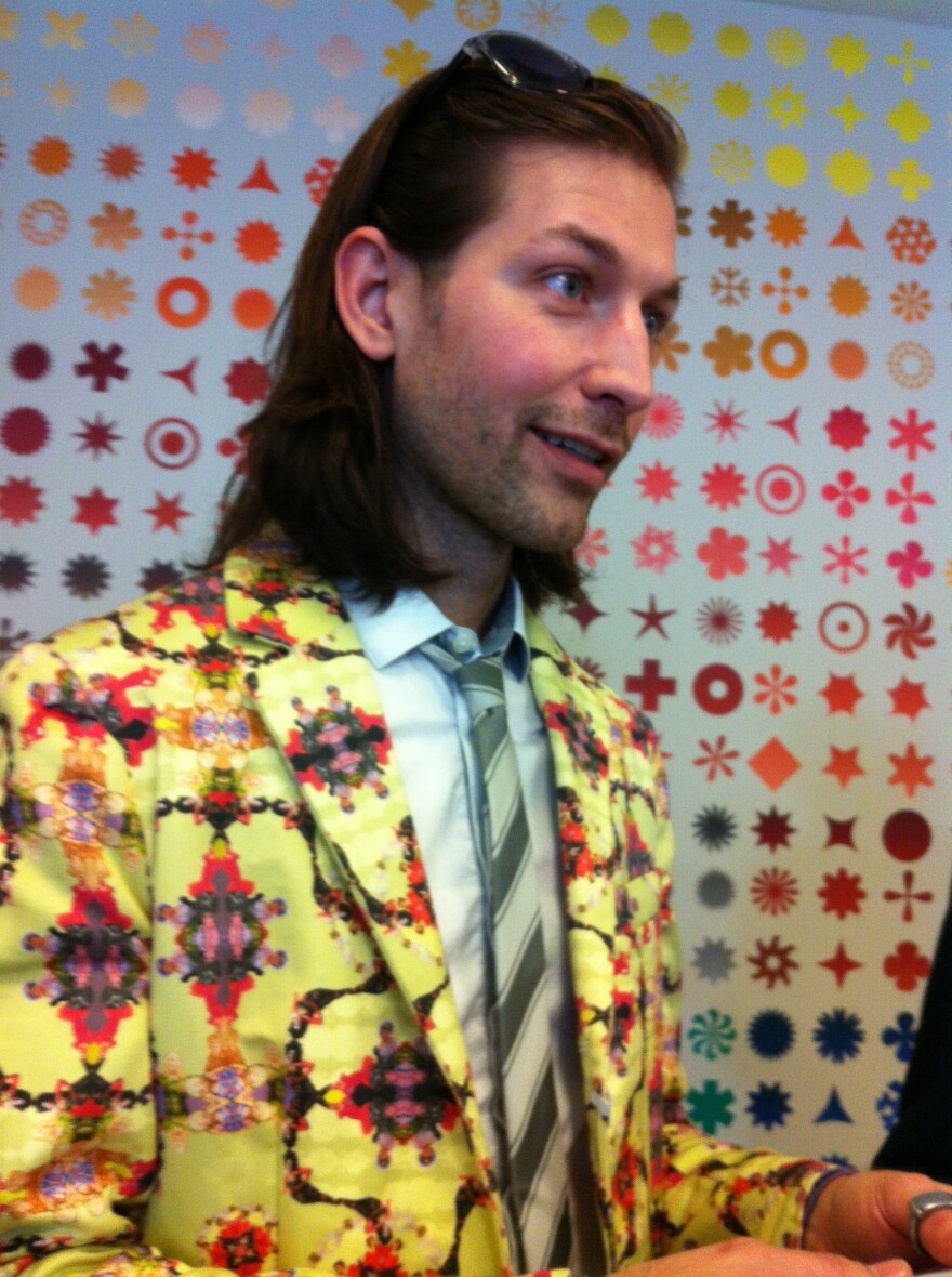 One of the best outfits at the exhibit wasn't actually part of the show: Museumgoer Aaron Peterman designed and made this suit, with its pattern of legendary drag queens on a sunny yellow background.