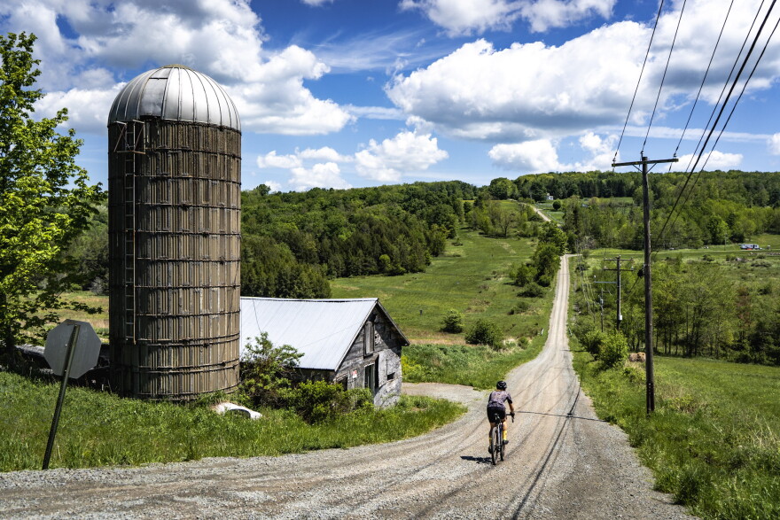 A gravel cyclists rides in Union Dale on one of the Endless Mountain Gravel routes.