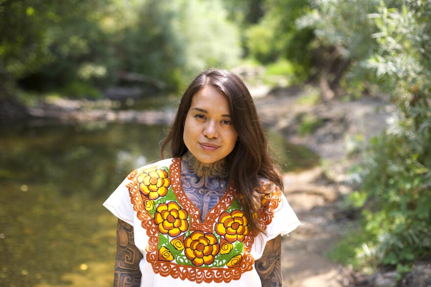 Arleene Correa Valencia stands by the creek on the Silverado Trail in Napa Valley.