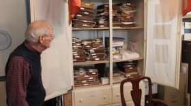 Jim Hodges, a curator at the New Bern Historical Society, studies the collection of historical books and documents collected by the historical society, including the John Oliver ledger, which recorded the infamous Stanly-Spaight duel.