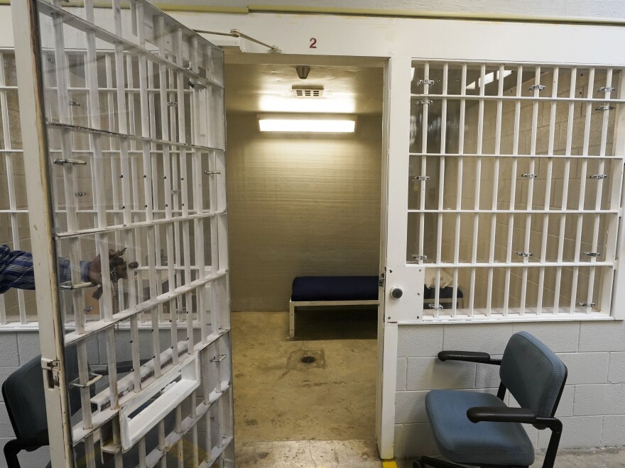 A bed is seen through the bars in one of the holding cells near the death chamber at Greensville Correctional Center in Jarratt, Va., earlier this year.