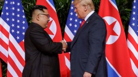 Mandatory Credit: Photo by Evan Vucci/AP/Shutterstock (9710094b) Donald Trump, Kim Jong Un. U.S. President Donald Trump shakes hands with North Korea leader Kim Jong Un at the Capella resort on Sentosa Island in Singapore Trump Kim Summit, Singapore, Singapore - 12 Jun 2018
