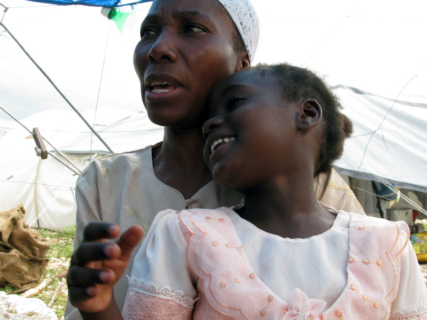 Yvonne Antoine, 45, lives in Camp Corail with three of her four children, including Louisemie. Antoine lost her house and her job in the quake, and says her husband went insane when he thought his children had all died.