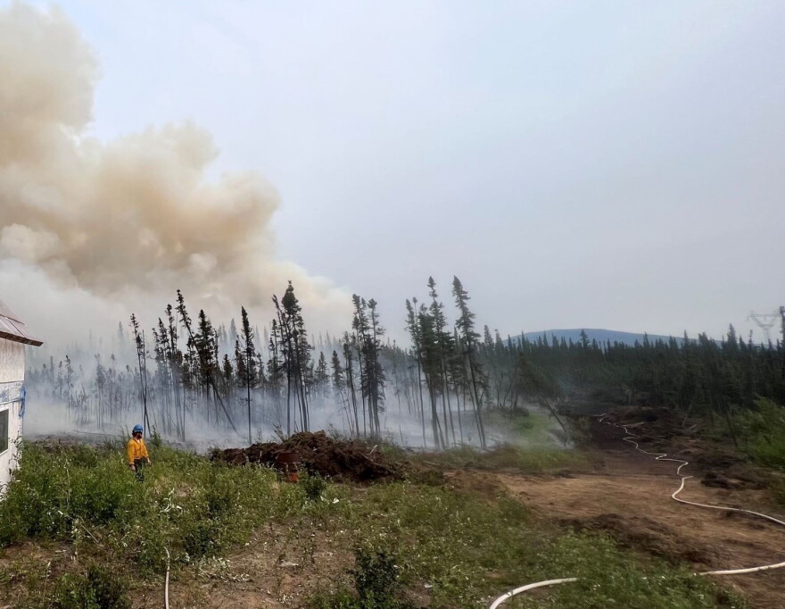 Clear Fire crews conduct a burnout operation earlier this month to protect a structure in the path of the fire. The controlled burn removes vegetation and other fuels to reduce the chances of a wildfire burning in the area.