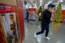 People shop among holiday displays at a Sam's Club, Wednesday, Sept. 24, 2025, in Bentonville, Ark.