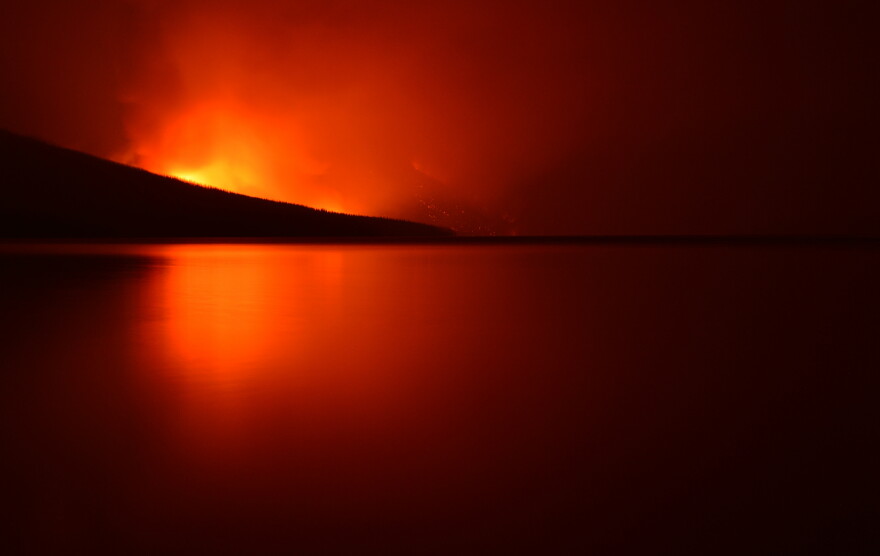 The Howe Ridge Fire in Glacier National Park as seen from Apgar Beach, August 12, 2018.