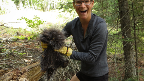 Charlie Mitchell, beaming with delight, holds a porcupine in Canada on August 19, 2018.