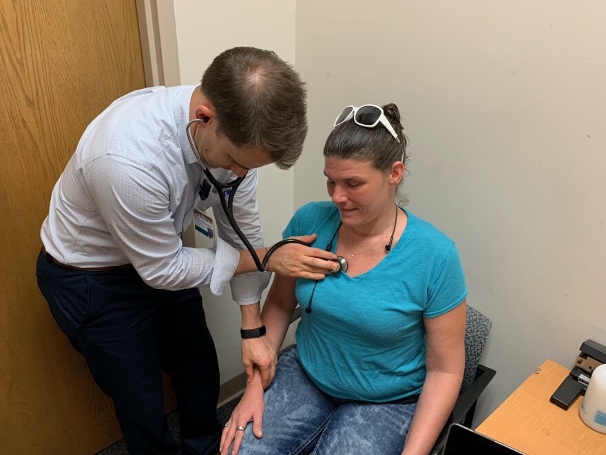 Dr. Billy Sullivan at Vanderbilt University Medical Center listens to the weakened heart of Traci Grimes, 37, who is now in recovery but has been battling endocarditis and other infections related to her drug use.