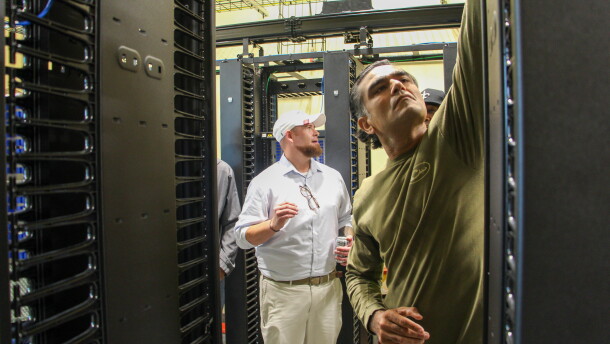 Fletch Batchelor (center) shows students around Louisiana Delta Community College's mock data center on Aug. 18, 2026.