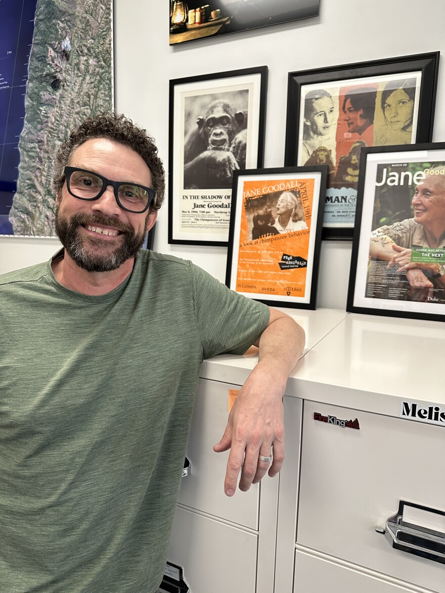 Ian Gilby poses at the Jane Goodall Archive at Arizona State University.