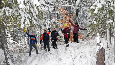 Tin Mountain Winter Wanderers are all smiles while exploring the 300+ acres at the Albany, NH Nature Learning Center.