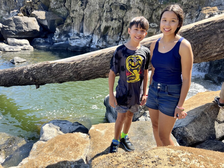 Miracle Edmiston, 14, and her brother, Eagle, are in search of lamprey.