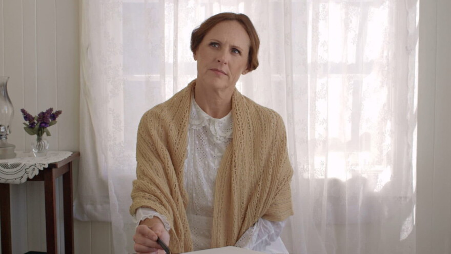 Emily (Molly Shannon) thinking at her desk, in a still from "Wild Nights With Emily." (Courtesy of Greenwich Entertainment)