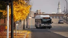 An Akron METRO RTA bus drives along East Mill Street in Downtown Akron.