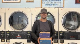 Zae Illo at the 8th Street Laundry in the Tenderloin, where he helps unhoused people wash their clothes.
