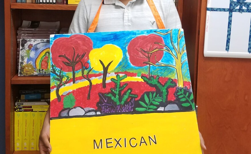 luis_silva_with_sign_designed_by_him_0.jpg