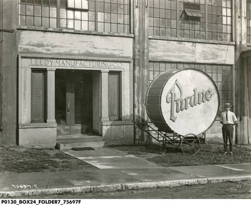 Purdue Bass Drum in front of Leedy Manufacturing Company in Indianapolis, 1921