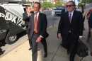 Attorney Al Watkins, pictured here walking out of court on May 1, 2018 with his then-attorney Chuck Hatfield, has admitted he violated a gag order in the Eric Greitens case.