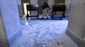 Capitol workers remove damaged furniture on from the U.S. Capitol on January 7, 2021, following the riot at the Capitol the day before.