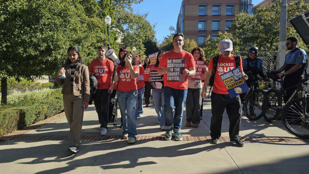 Dozens of UC students march outside a meeting of the University of California Board of Regents in Los Angeles to protest the system’s plan to continue annual tuition increases on Nov. 19, 2025.