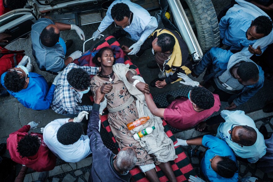 An injured resident of Togoga, a village about 12 miles west of Mekele, is carried on a stretcher to the Ayder Hospital in Mekele a day after a deadly airstrike on a market in Ethiopia's war-torn northern Tigray region. Medical workers face an extreme shortage of medicine and supplies to treat patients.