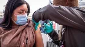 Image of California resident receiving a COVID-19 booster shot.