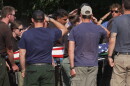 The body of a firefighter who died battling wildfires near the Colorado-Utah border is carried during a procession in Grand Junction, Colo., Monday, June 29, 2026. (AP Photo/Ty ONeil)