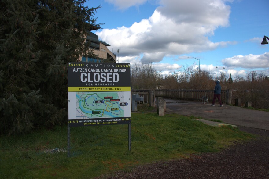 A sign announcing the Autzen Canoe Canal Footbridge's closure sits in front of the bridge on Monday, Feb. 9, 2026.