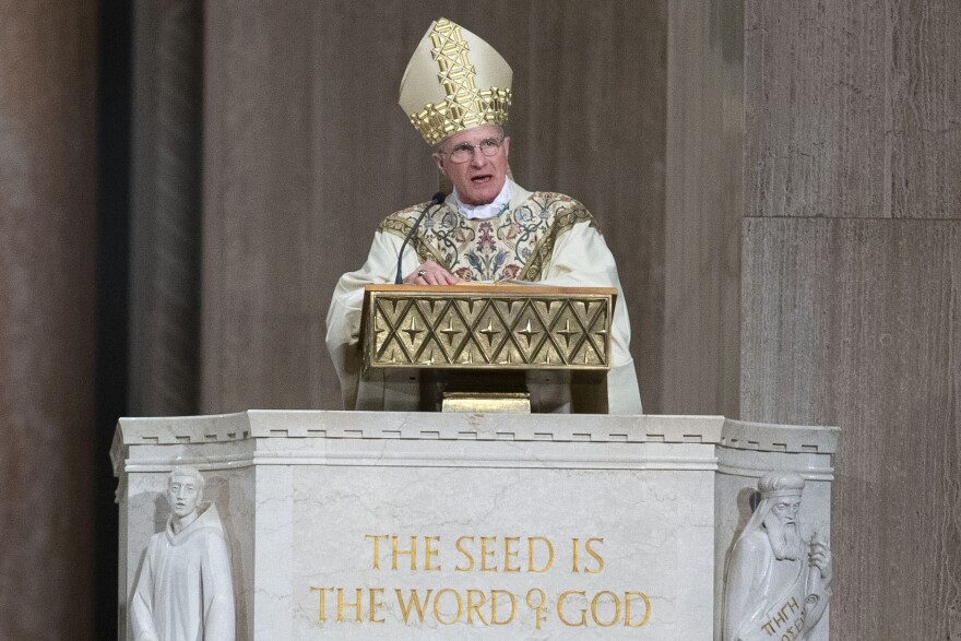 FILE - Archbishop Timothy Broglio conducts an Easter Sunday Mass at Basilica of the National Shrine of the Immaculate Conception in Washington, April 12, 2020. 
