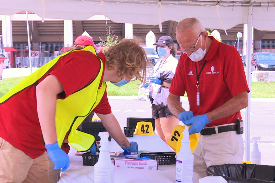 IU staff prepare to test students returning to campus at Memorial Stadium.